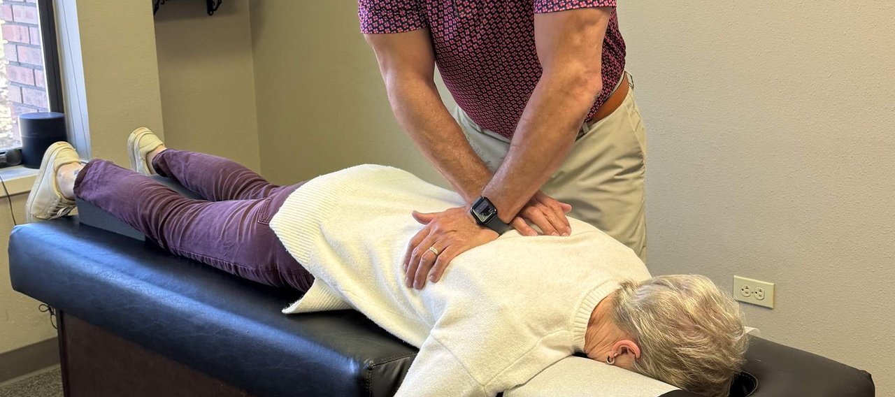 Dr. Aaron Smith giving a patient a chiropractic adjustment at Back to Health Chiropractic in Colorado Springs